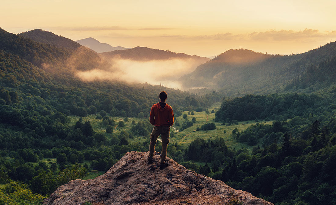 Man in nature on mountain top