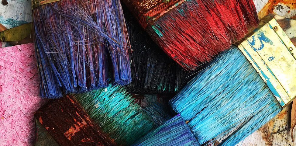 Colorful paintbrushes lying in a pile.